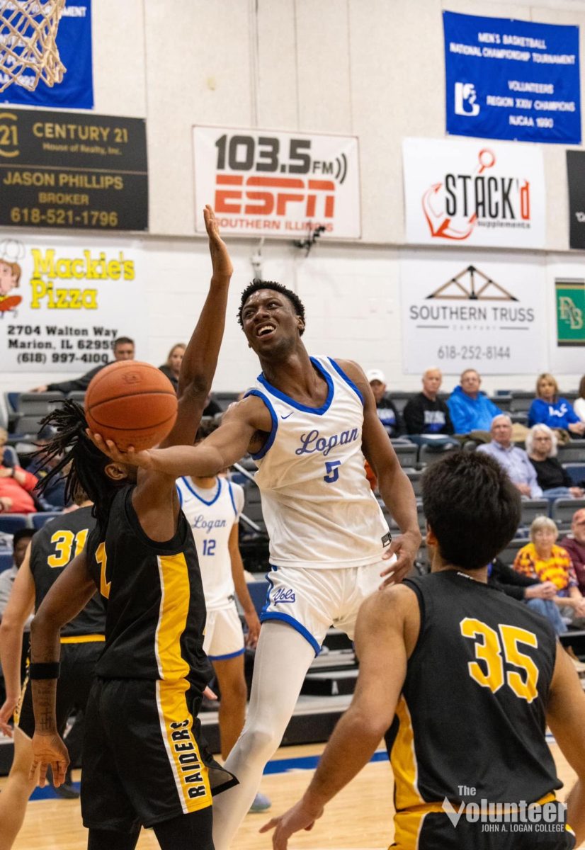 Freshman Davius Loury meets a defender at the rim before laying in a contested finger roll during the home game against the Three Rivers Community College Raiders on Saturday, Dec. 7.