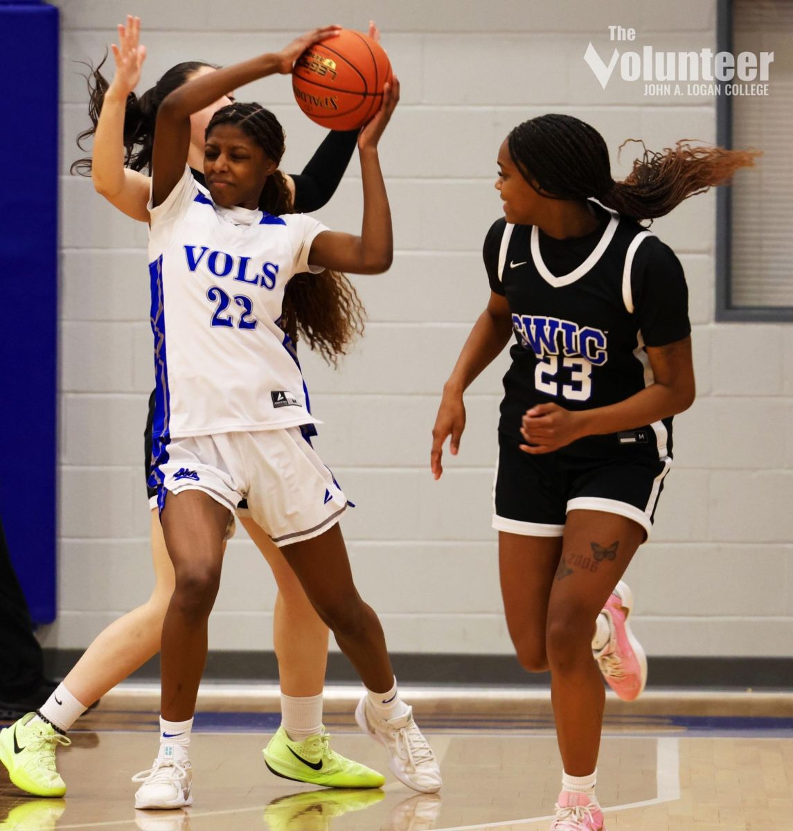 JALC Freshman Janiya Harrison keeps the ball away from SWIC's defensive players Monday, Feb. 24.