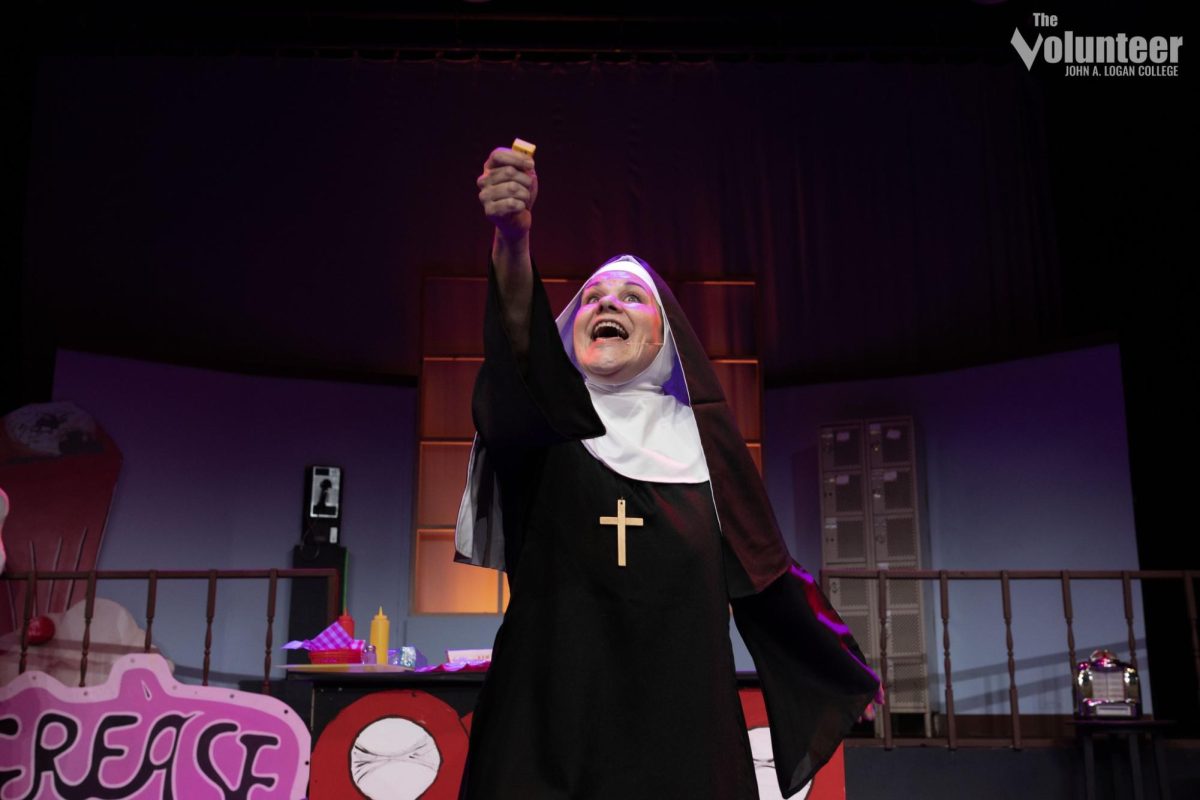 Krista Chmiel, a member of John A. Logan College’s faculty, graces the stage as Mother Superior in Nunsense.