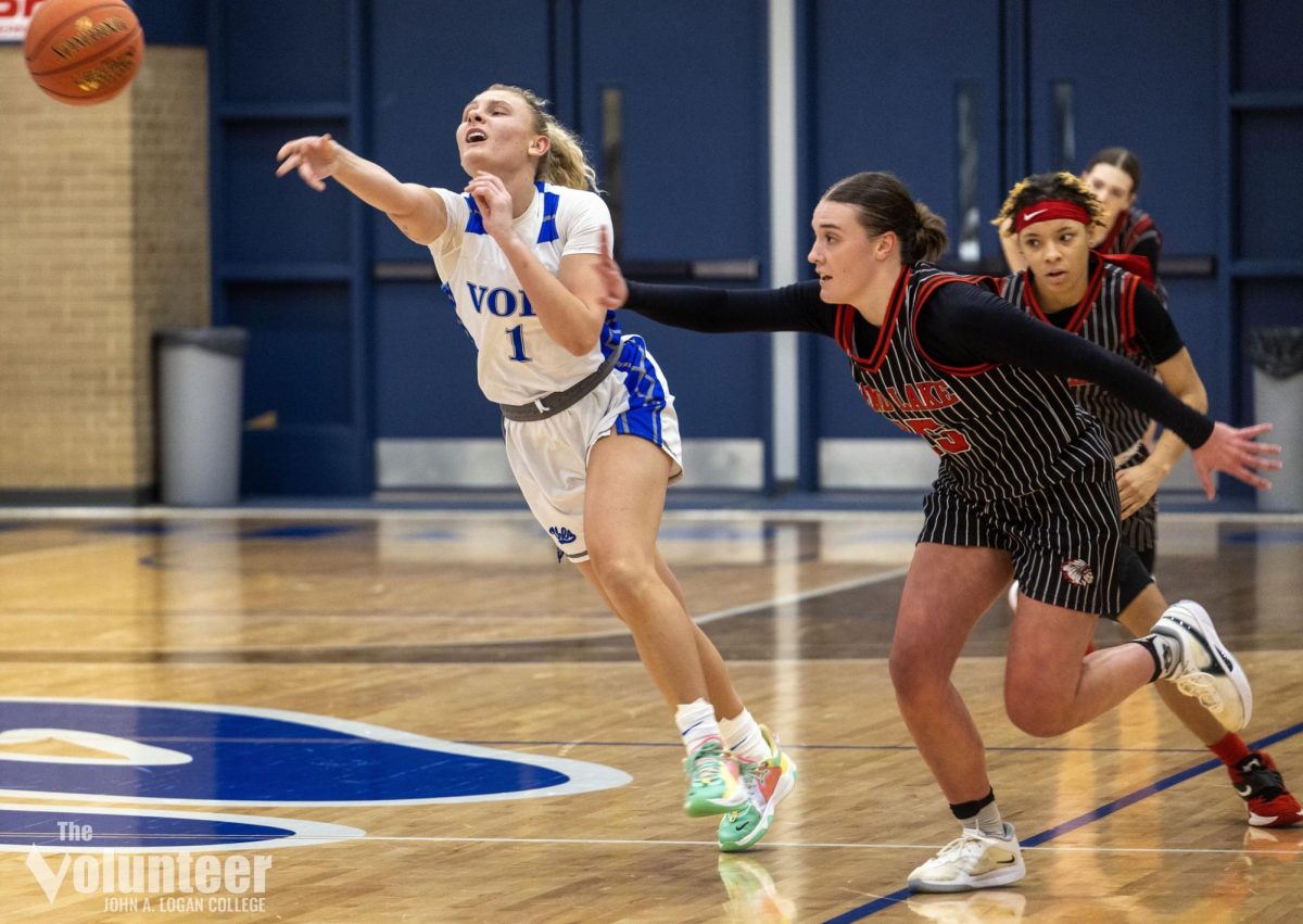 JALC sophomore Patricija Tamasauskas makes a pass under pressure during Wednesday night’s game against Rend Lake College. The Lady Vols took a 68-55 victory. 