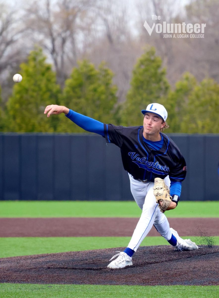 JALC right-handed pitcher Connor Hughes winds up a pitch across the plate during the game against Southeastern Illinois College, Mar. 21.