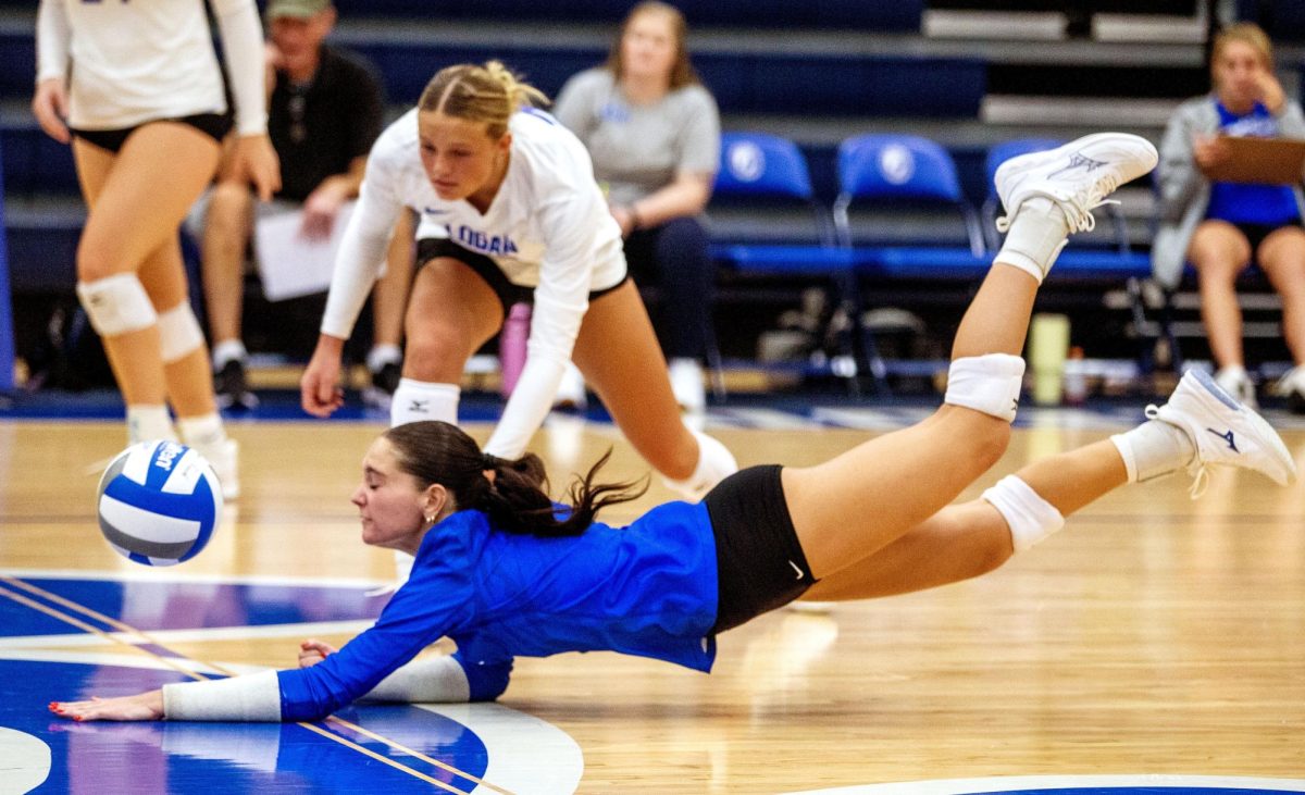 John A. Logan’s Grace Newell dives for a save to keep a rally alive during Wednesday’s match against Rend Lake College in Carterville.