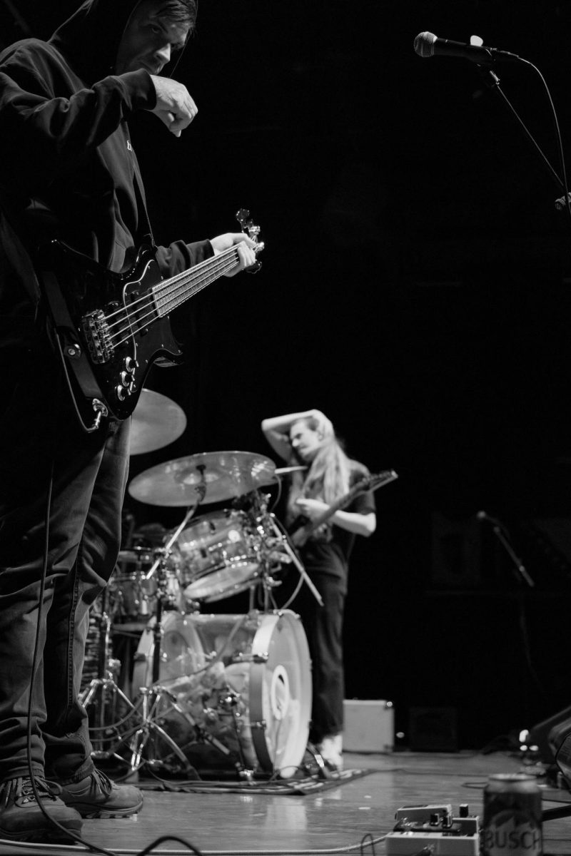 Bassist and vocalist Martin Ruppert (left) and guitarist Tyler Wait (center) of Sawed Off stand in anticipation of the band’s performance at Red Flag Concert Hall, St. Louis, MO, Nov. 01 2025.
