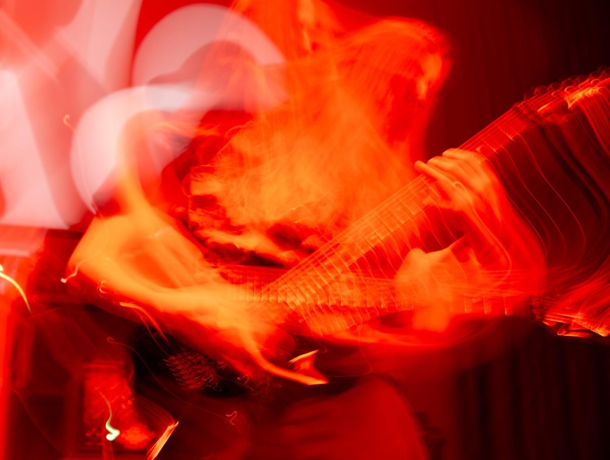 An abstract photo shows Sawed Off guitarist Tyler Wait playing on stage at Red Flag Concert Hall in St. Louis, Mo., on Nov. 1, 2025.