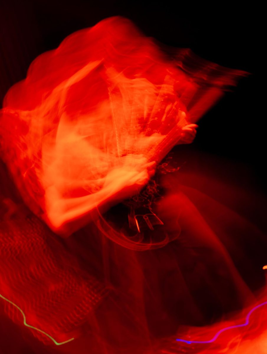 An abstract photo shows Sawed Off guitarist Tyler Wait playing on stage at Red Flag Concert Hall in St. Louis, Mo., on Nov. 1, 2025.