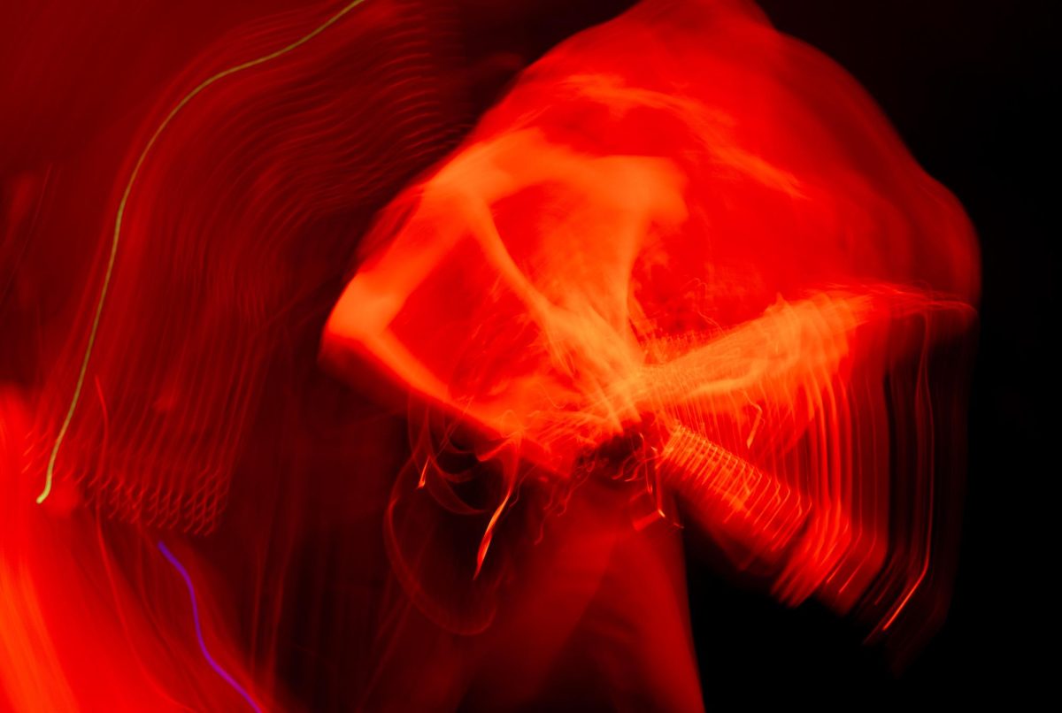 An abstract photo shows Sawed Off guitarist Tyler Wait playing on stage at Red Flag Concert Hall in St. Louis, Mo., on Nov. 1, 2025.