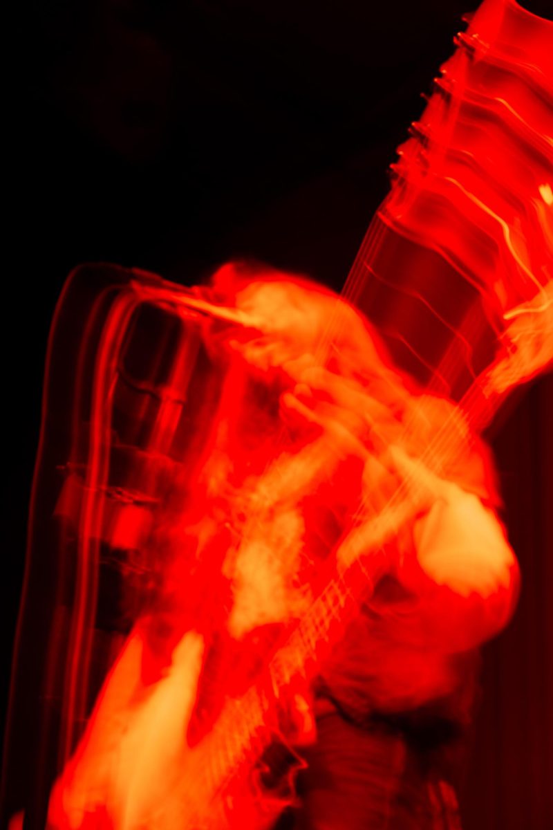 An abstract photo shows Bastardane bassist Luca Badan playing bass on stage at Red Flag Concert Hall in St. Louis, Mo., on Nov. 1, 2025.
