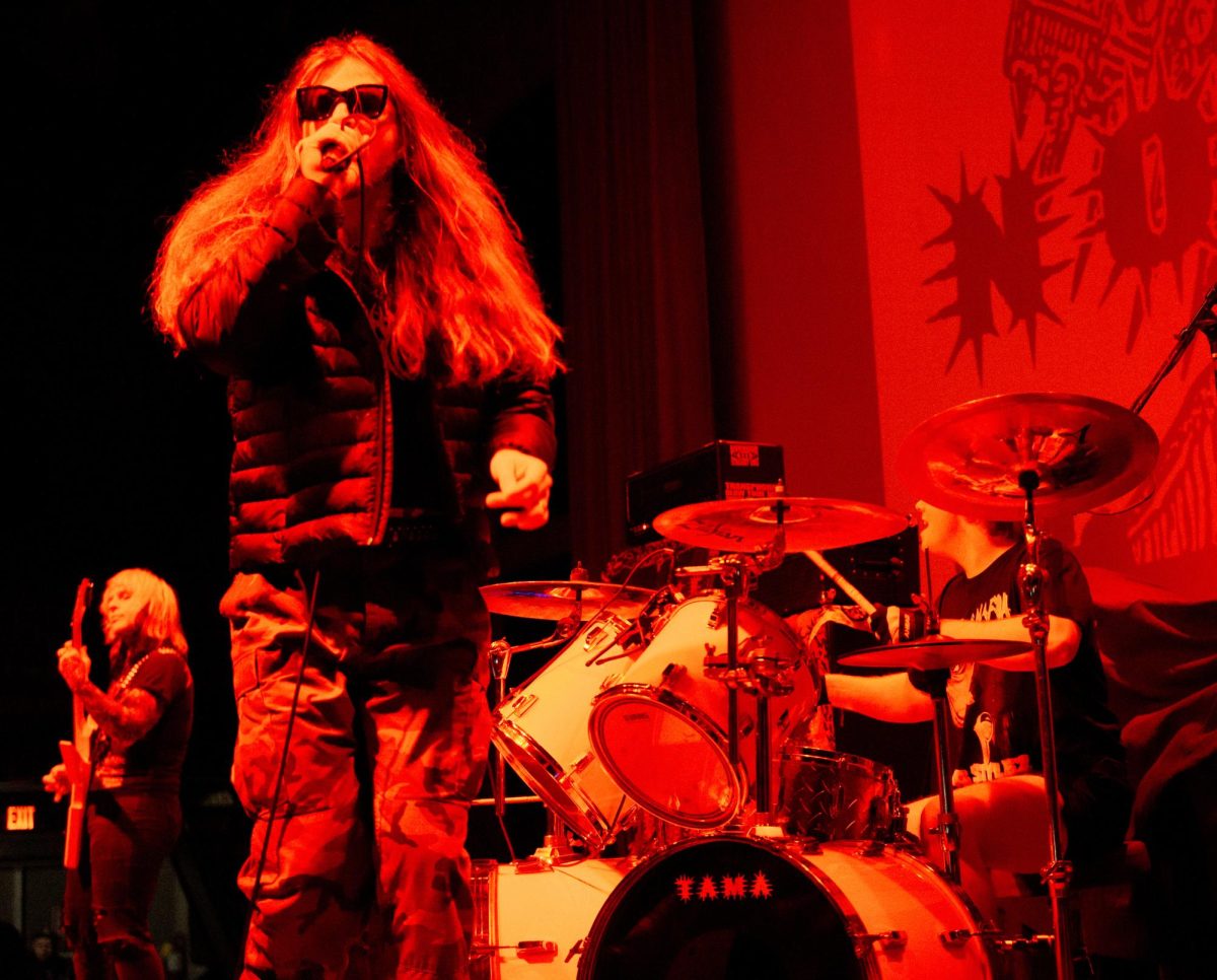 Guitarist Aesop Mongo, left, vocalist Blaythe Steuer, center, and drummer Duncan Newey, right, of No Cure play live at Red Flag in St. Louis, Mo., on Nov. 1, 2025.