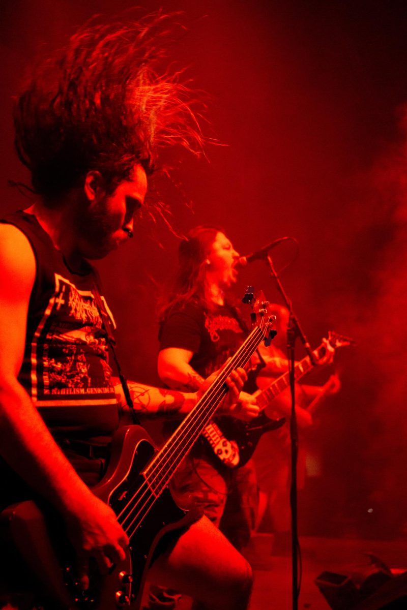 Bassist Todd Thompson, left, frontman Steve Buhl, center, and guitarist Raymond MacDonald of 200 Stab Wounds perform live at Red Flag in St. Louis, Mo., on Nov. 1, 2025.
