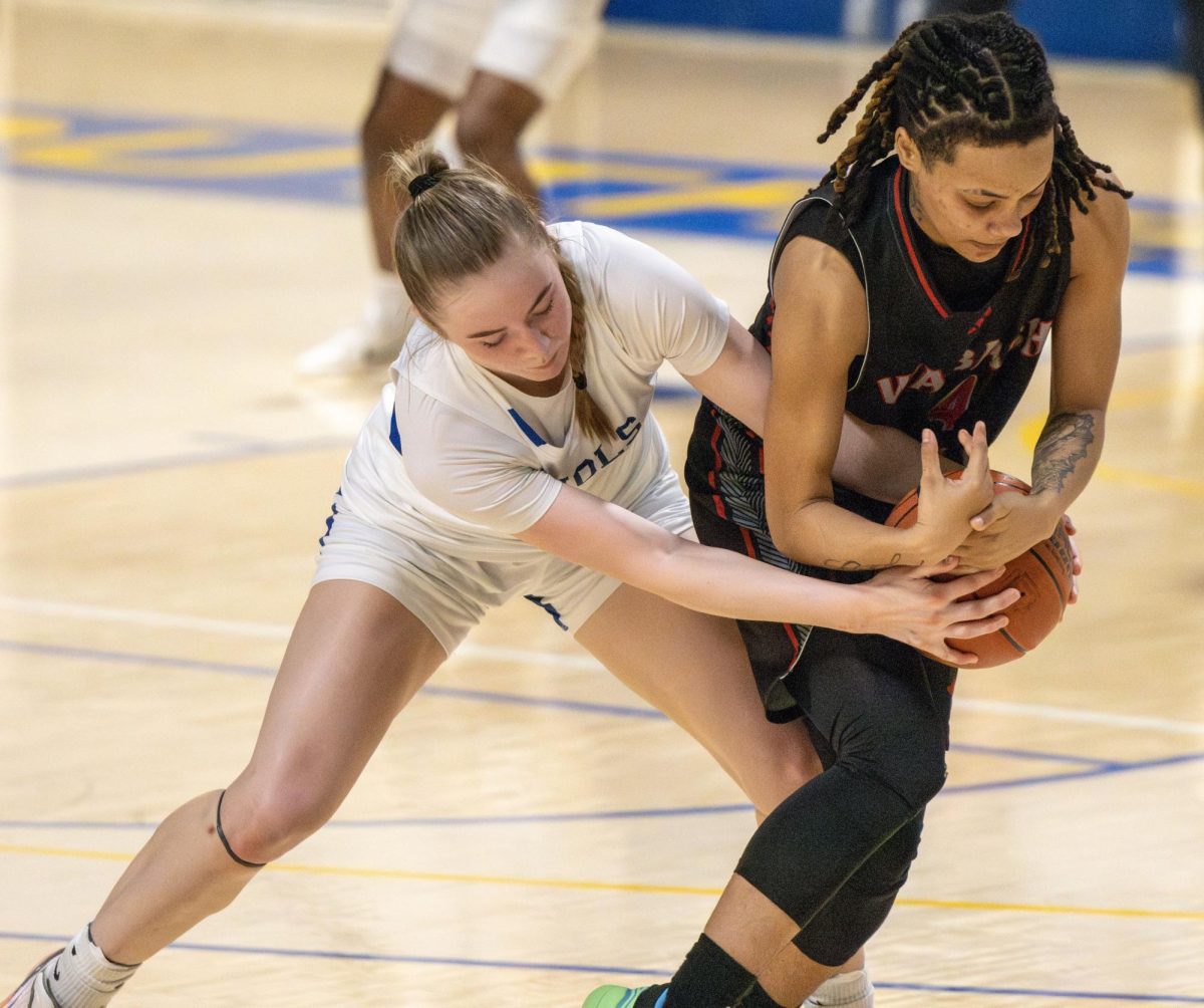 John A. Logan's Gracyn Morris attempts to fight for the ball at Wabash Valley during an away game. 