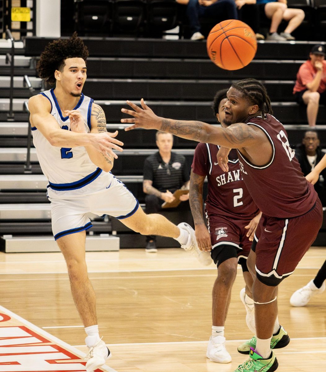 John A. Logan College’s Christian Doerr passes the ball as a Shawnee Community College defender reaches in during a game March 4, 2026, at Banterra Sports Complex in Ina, Ill.