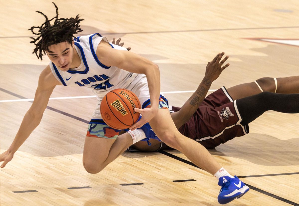 John A. Logan College guard Kyrese Lukens maintains control of the ball after falling to the court against Shawnee Community College March 4, 2026, at Banterra Sports Complex in Ina, Ill. The Vols beat Shawnee 81-58.