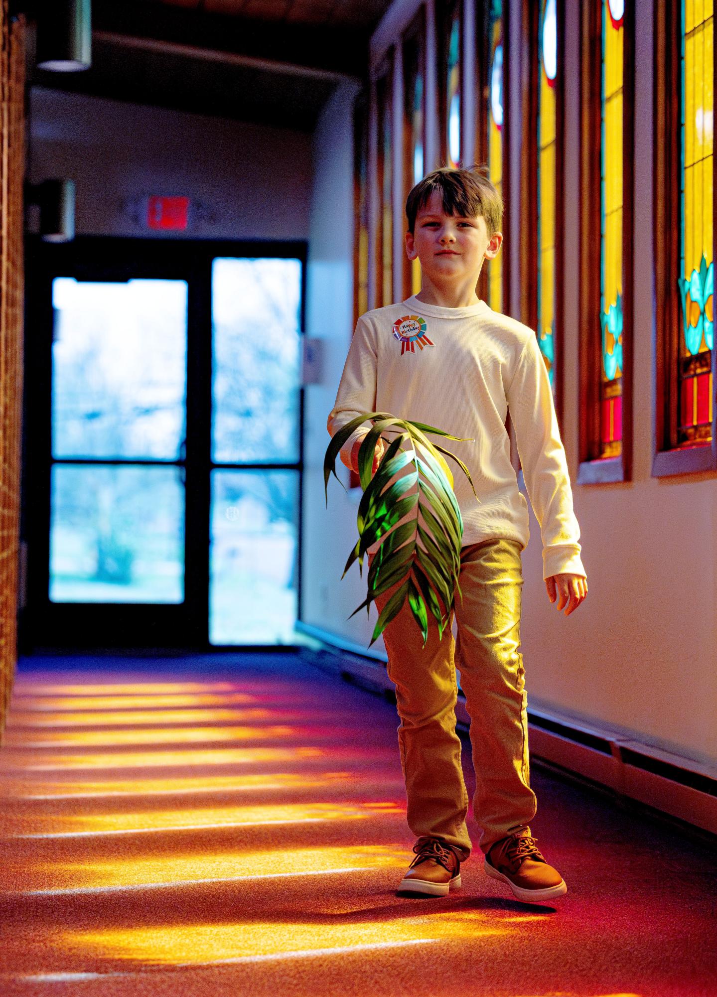 Davis Fields carries a palm branch during the children’s processional Sunday, March 29, 2026, at Crainville Baptist Church’s Palm Sunday service.