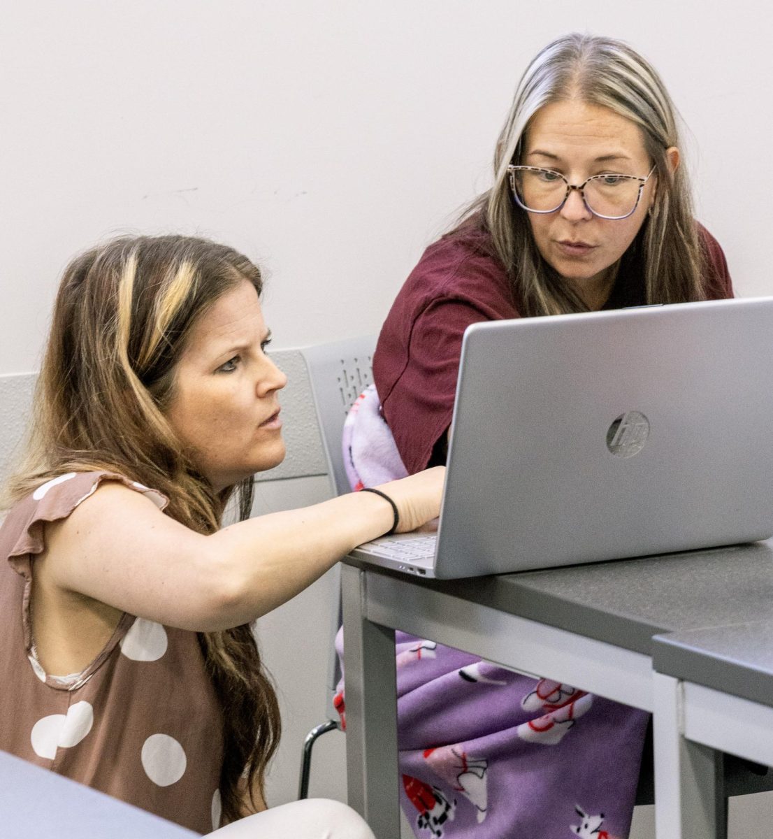 Renee Lacy, instructor of medical assisting at John A. Logan College, works with a student during a Medical Assistant program class. Lacy said she continues to work in a doctor’s office one day a week so she can bring current field experience back to her students.